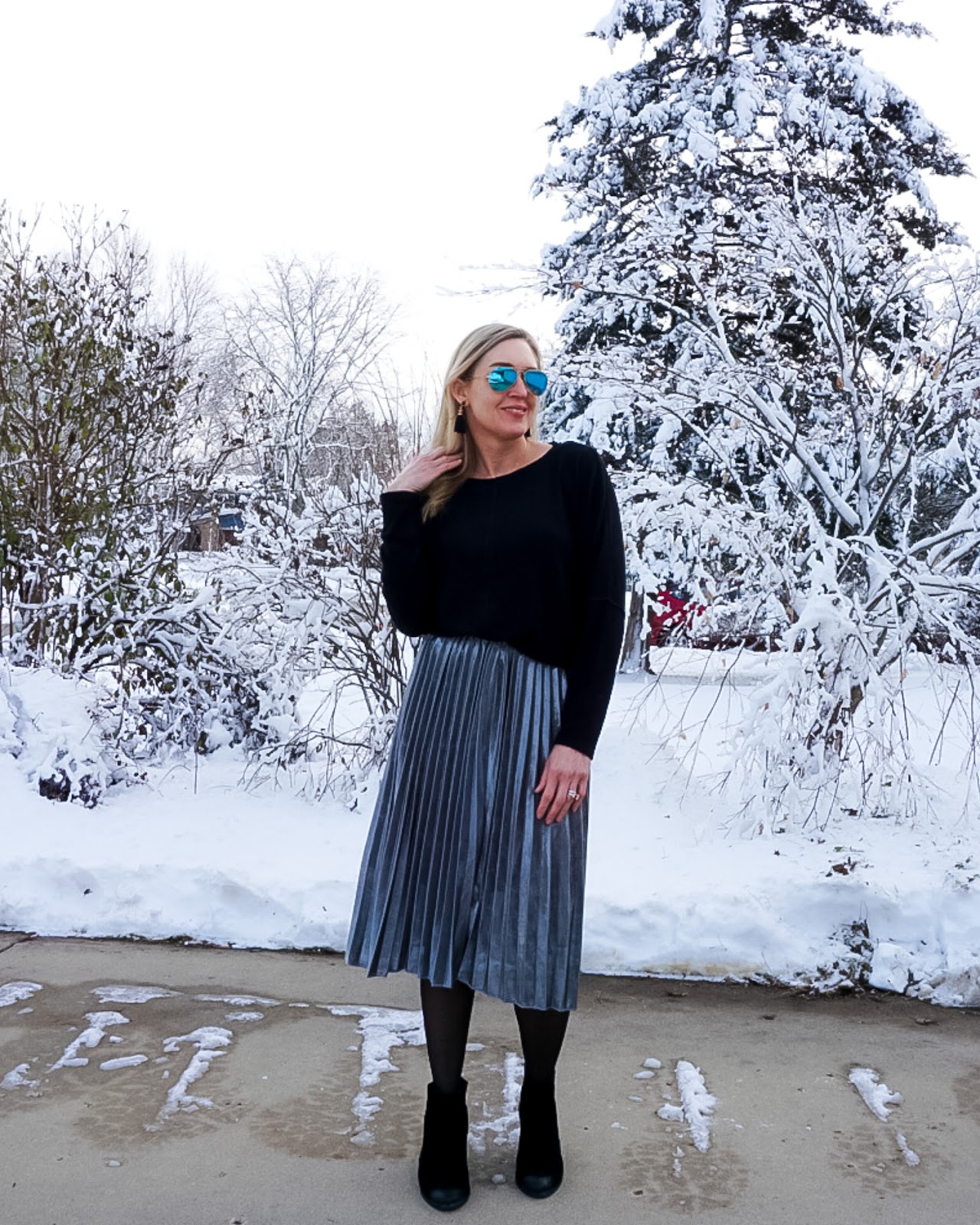 Metallic Pleated Skirt Holiday Outfit Idea Doused in Pink